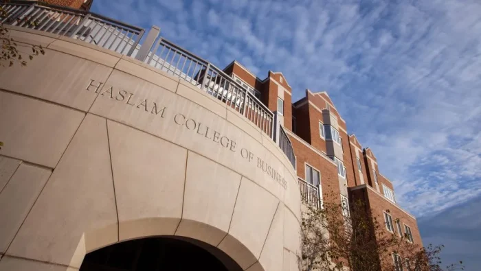 Photo from the ground of the Haslam Business Building's curved southern balcony
