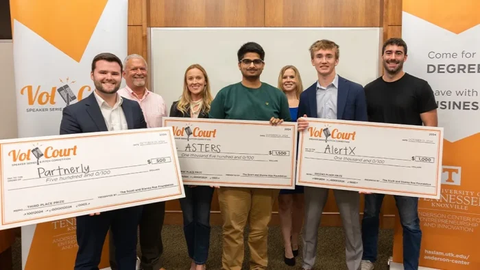 Vol Court winners pose with novelty checks and others involved in Vol Court fall 2024.|Vol Court winners pose with novelty checks and others involved in Vol Court fall 2024.|