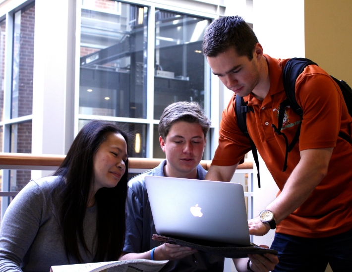 economics students studying on computer