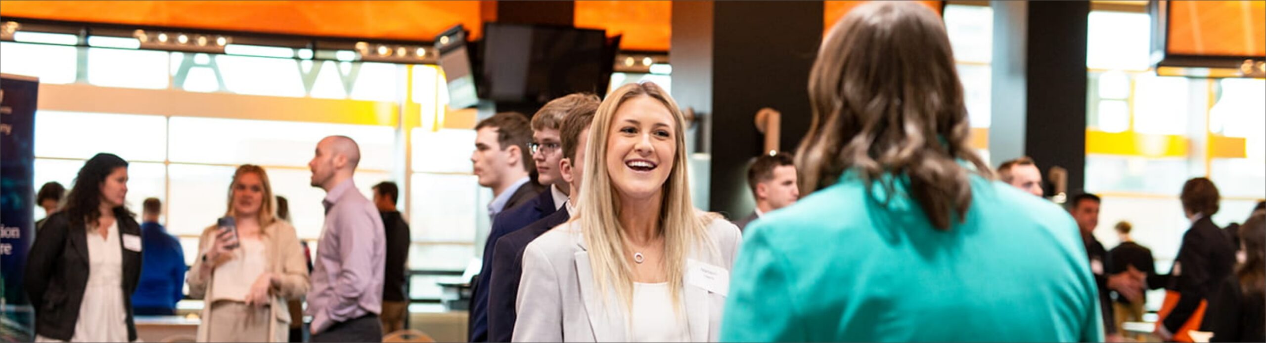 Women talking at a networking event