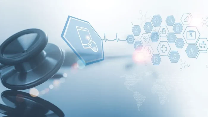 Stylized image with a stethoscope in the foreground and connected hexagons with symbols like "RX" and an ambulance in them