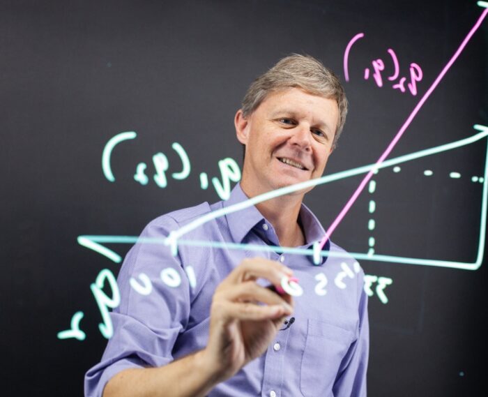 professor working on equations