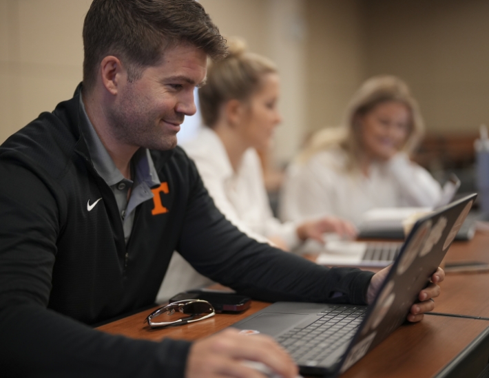 student on a laptop in class