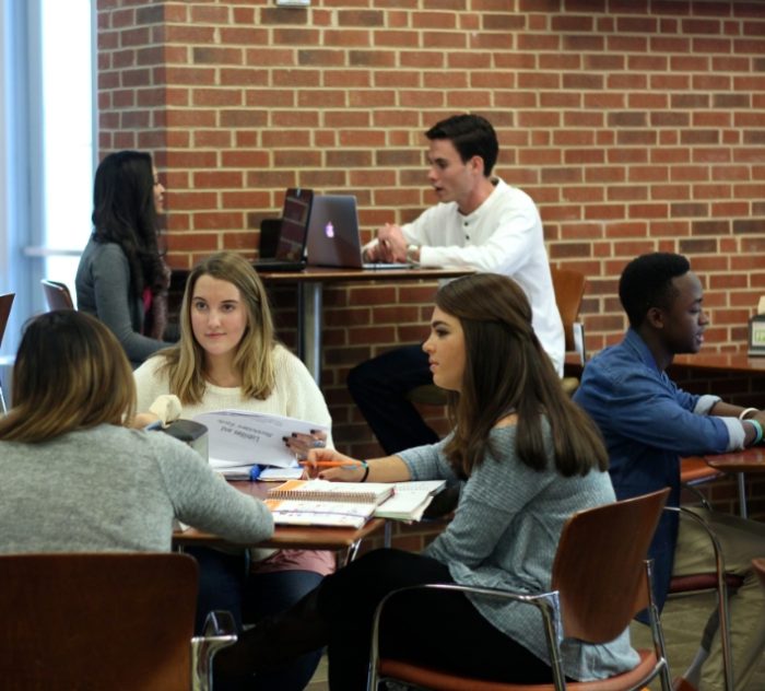 students working in common area