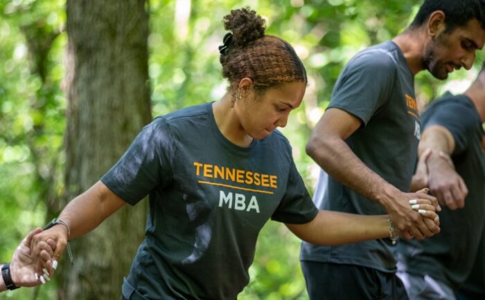 UTK MBA students doing an obstacle course