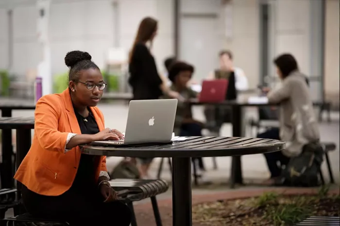 Student studying on a laptop
