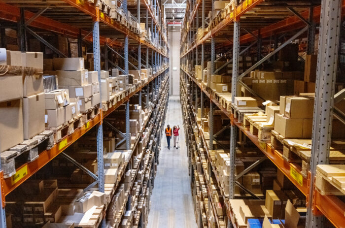 People in a warehouse full of boxes