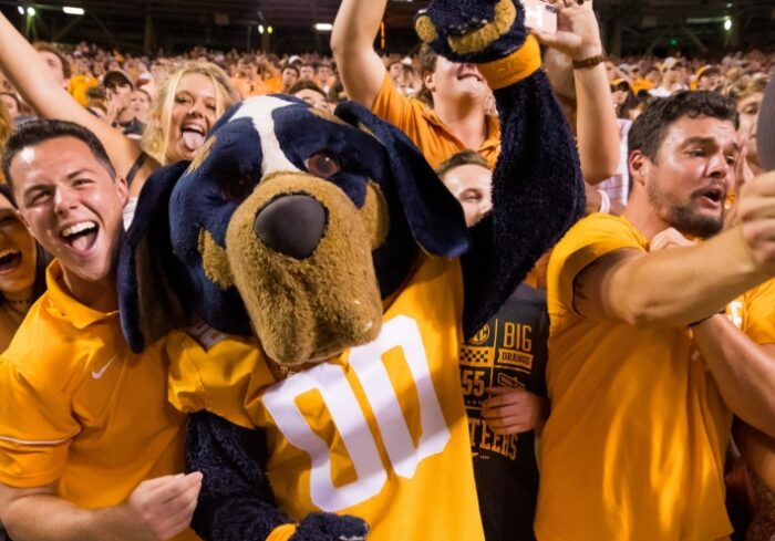 students with smokey at game