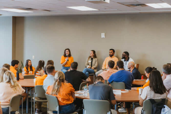 Haslam alumni group speaking with students